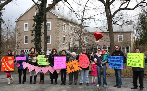 Group of community members holding signs during a preservation campaign at Plymouth Meeting, Montgomery County