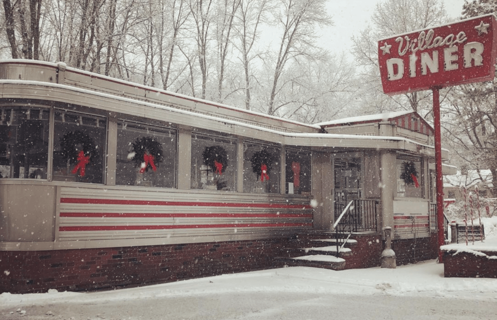 a vintage roadside diner in the snow