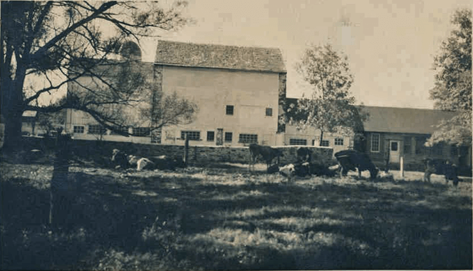 black and white photo shows a barn in good condition