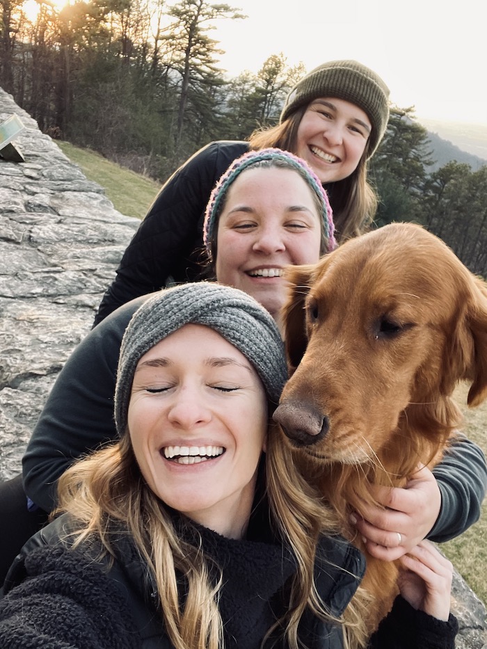three gal pals and a canine companion having fun