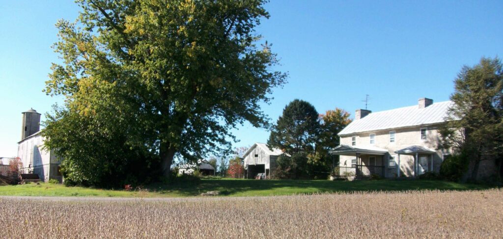 Peebles Homestead with farm buildings and the stone residence on the right