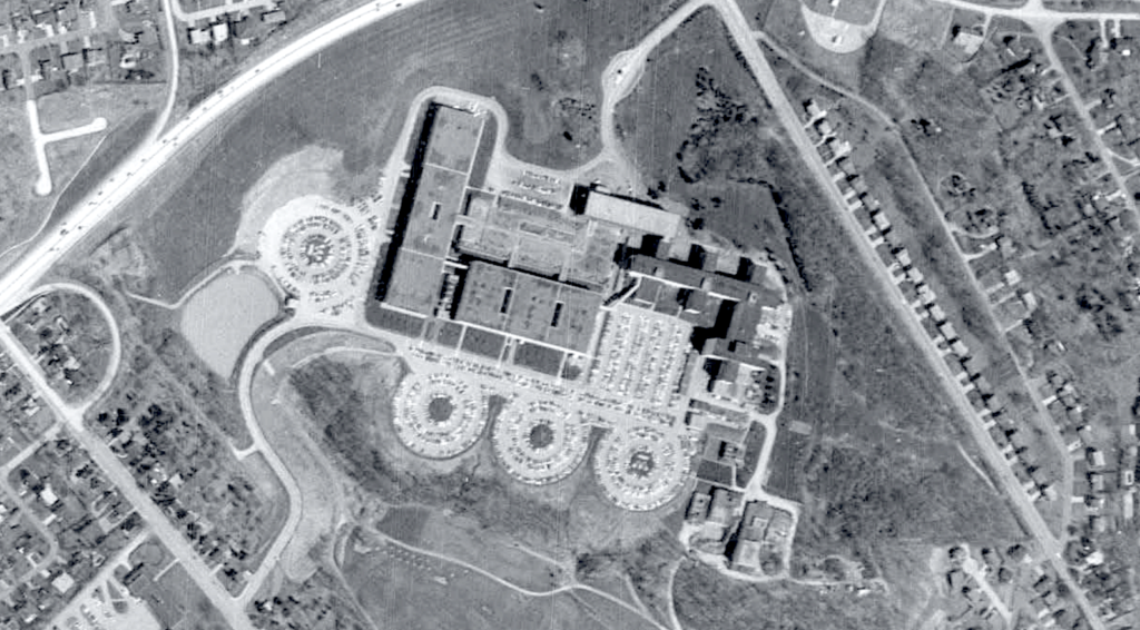 1973 aerial view of the Westinghouse R&D Center campus shows the building layout and design of the campus, including a series of circular parking lots