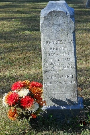 Gravestone with flowers at a Pennsylvania African American cemetery