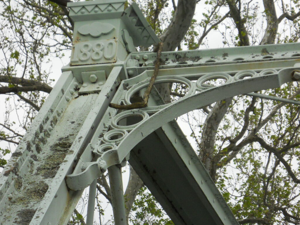 Upper portion of the Peevy Road Bridge showing the date 1880 cast in iron