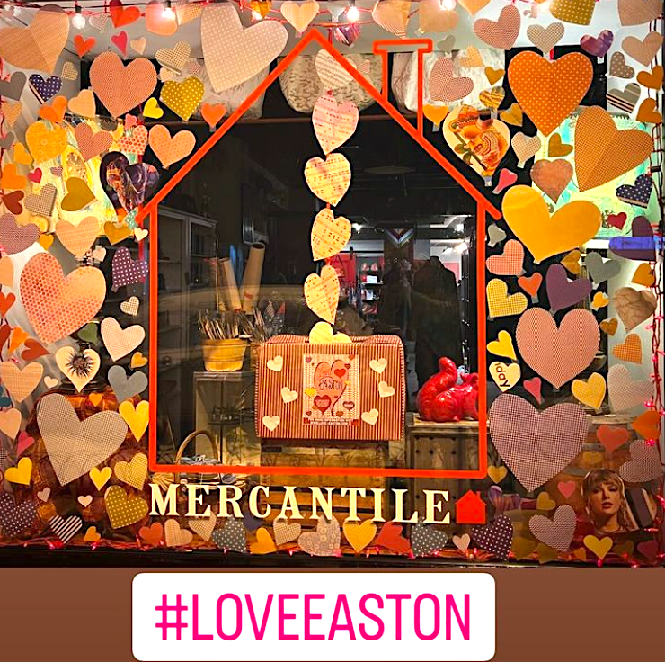 Colorful display of handmade hearts decorating storefronts and windows throughout Easton