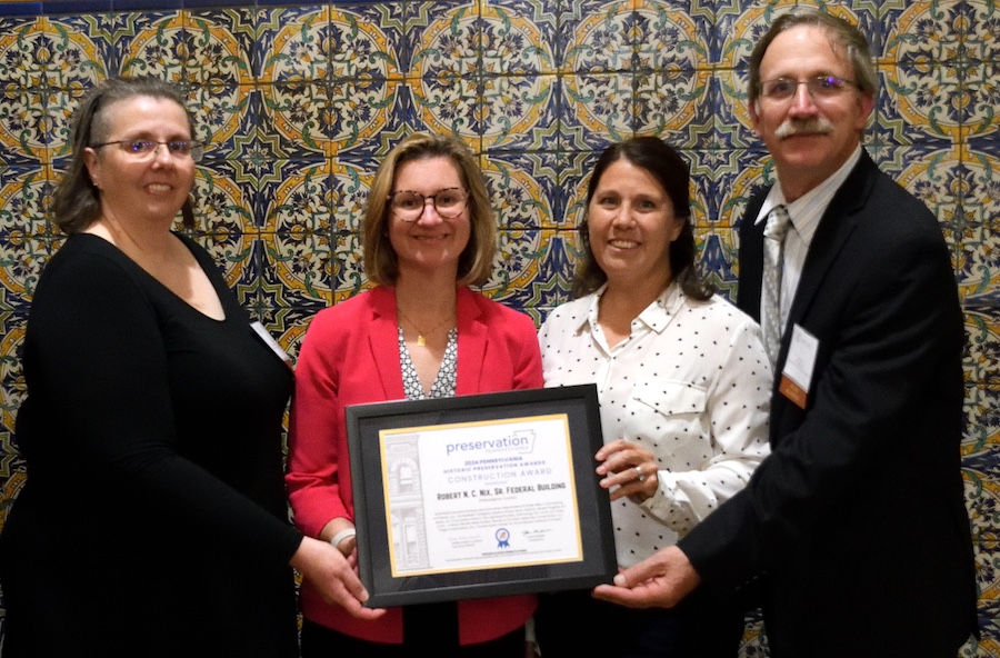 Donna Andrews, Bridget Bielicki, Jennifer Arnoldi, and Peter Solor accepting the Rehabilitation Award for the Robert N.C. Nix Sr. Federal Building