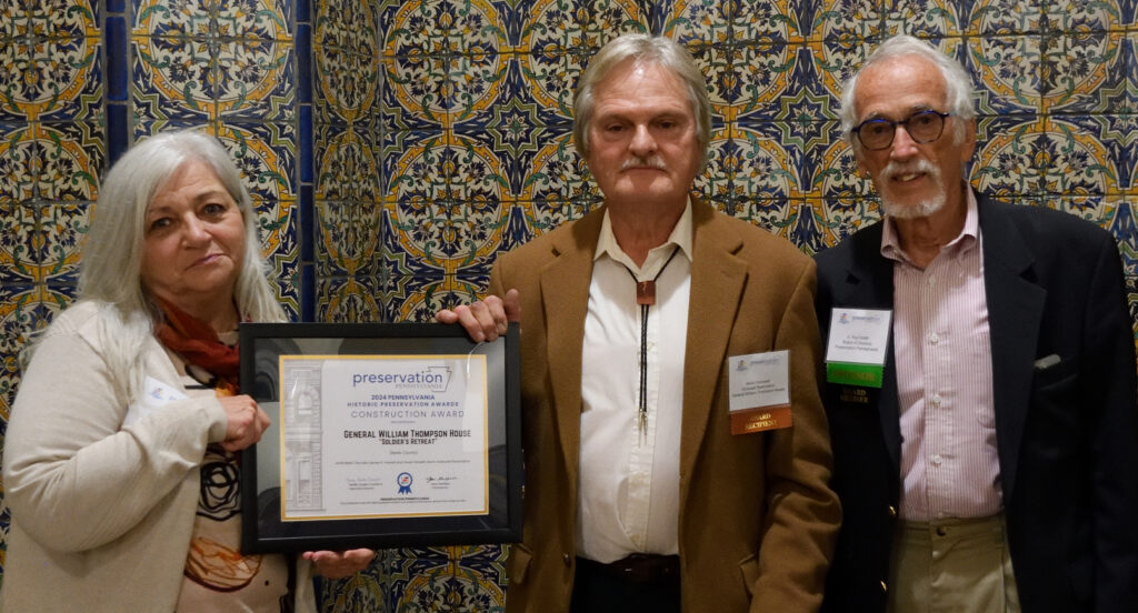 Christine Musser and Kevin Hollowell accepting the Rehabilitation Award for the General William Thompson House, with Roy Smith of Preservation Pennsylvania