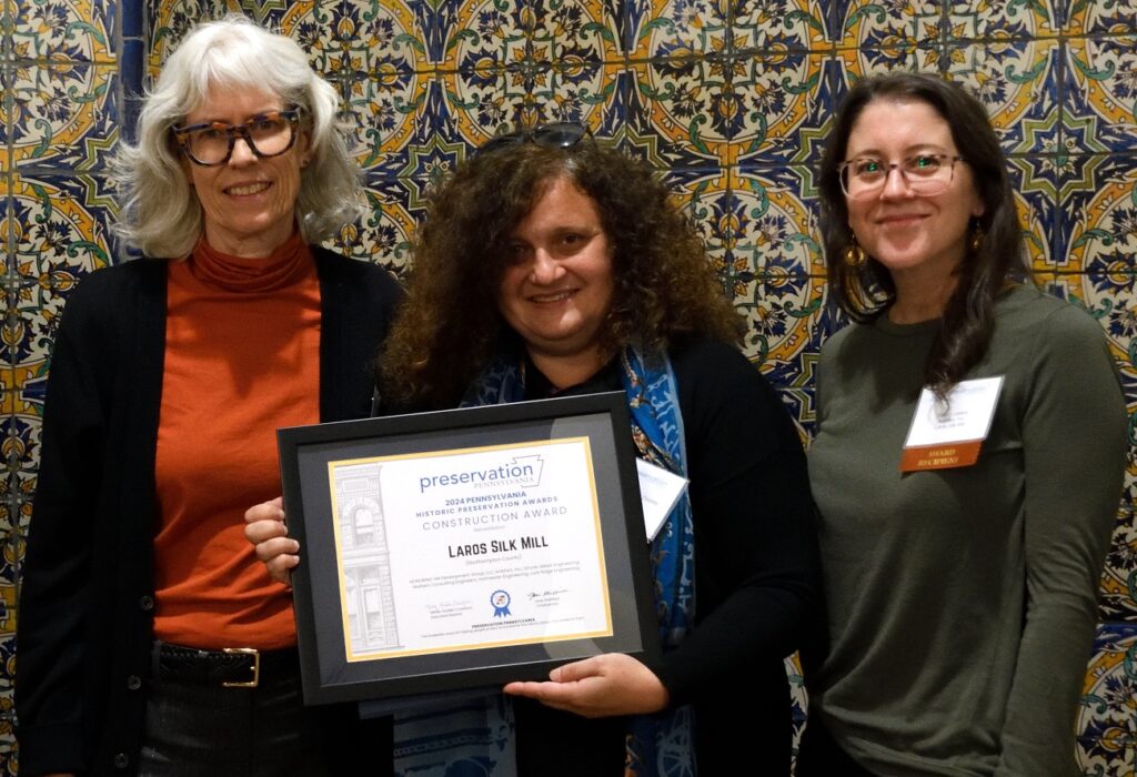 Christine Ussler, Lucienne Di Biase Dooley, and Caitlin Laskey of Artefact Inc. accepting the Rehabilitation Award for the Laros Silk Mill
