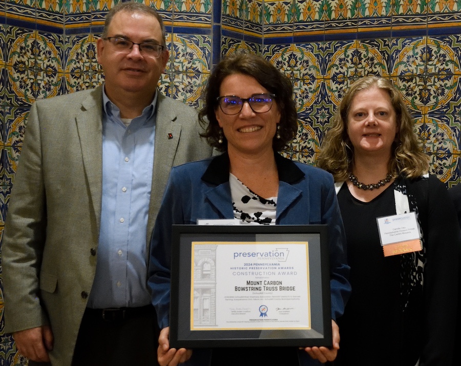 Brian Teles, Nina Ertel, and Camille Otto accepting the Rehabilitation Award for the Mount Carbon Bowstring Truss Bridge